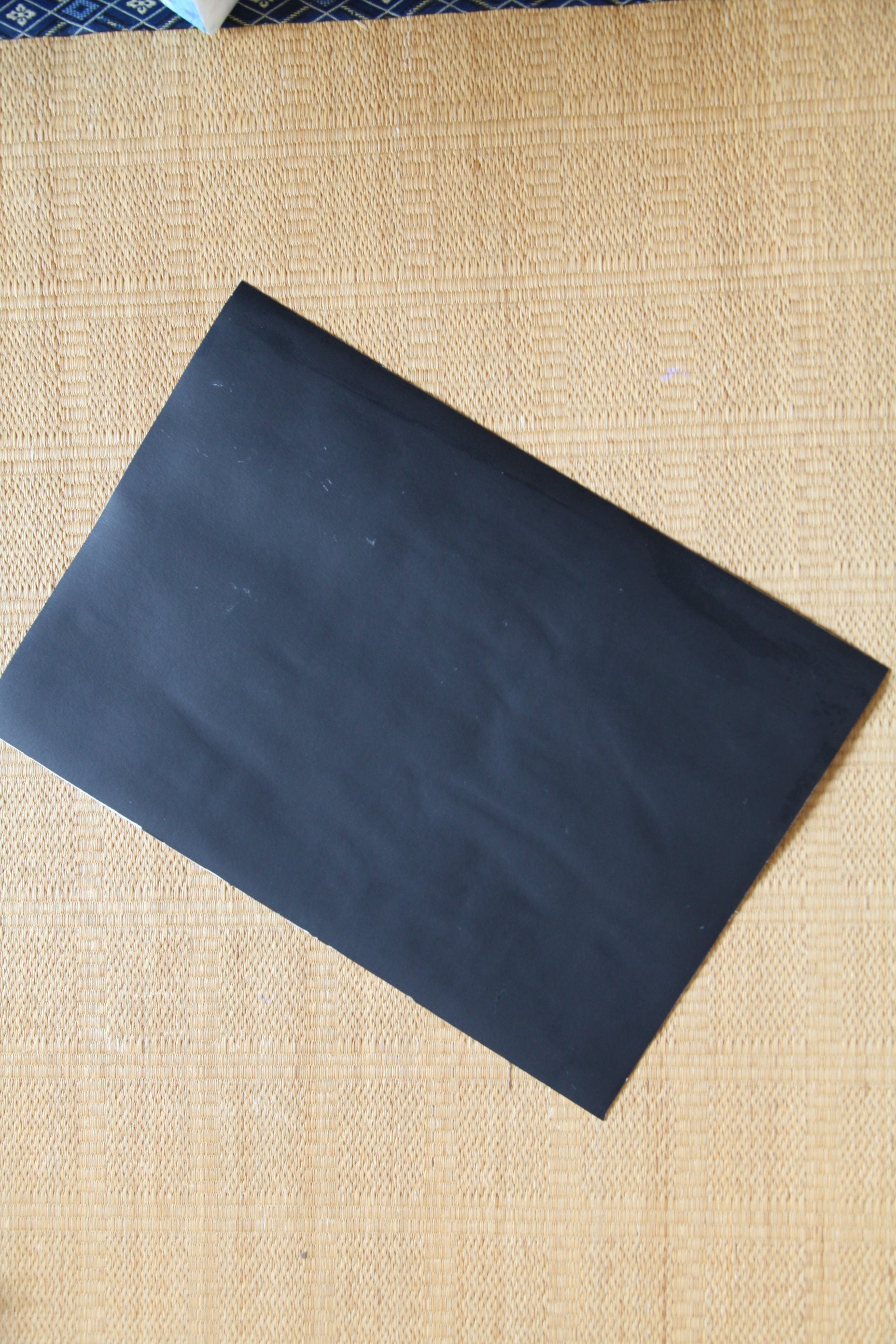 Black backing board of protected vintage manga art reproduction