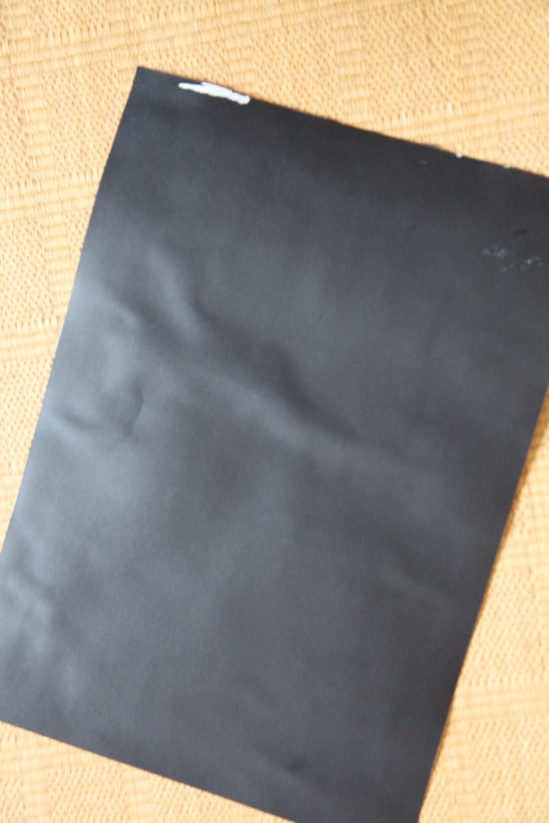 Black backing board of protected vintage manga art reproduction